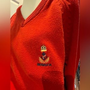 Red Bermuda v neck sweater.